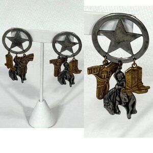 Silver-tone and gold-tone western/cowboy/sheriff statement earrings.